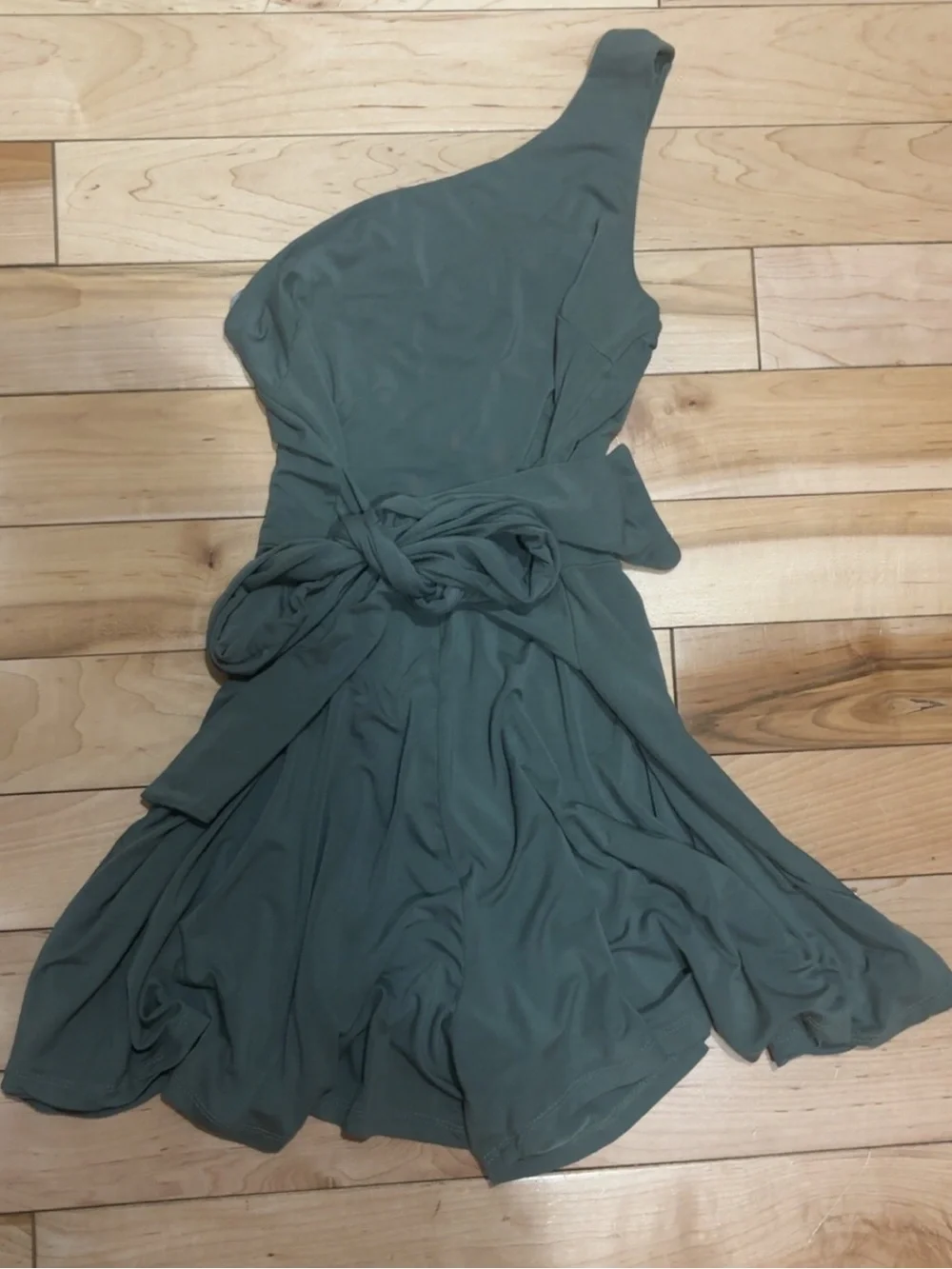 LULU’S SUNNY SOIRÉE DARK SAGE GREEN ONE-SHOULDER TIE-FRONT ROMPER